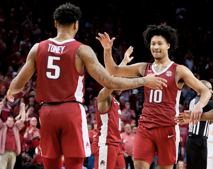 Arkansas Razorbacks forward Jaylin Williams (10) celebrates with guard Au'Diese Toney (5) during the second half against the Tennessee Volunteers at Bud Walton Arena. Arkansas won 58-48.